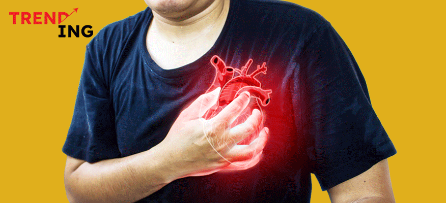 Man clutching chest, showing signs of heart pain or silent heart attack